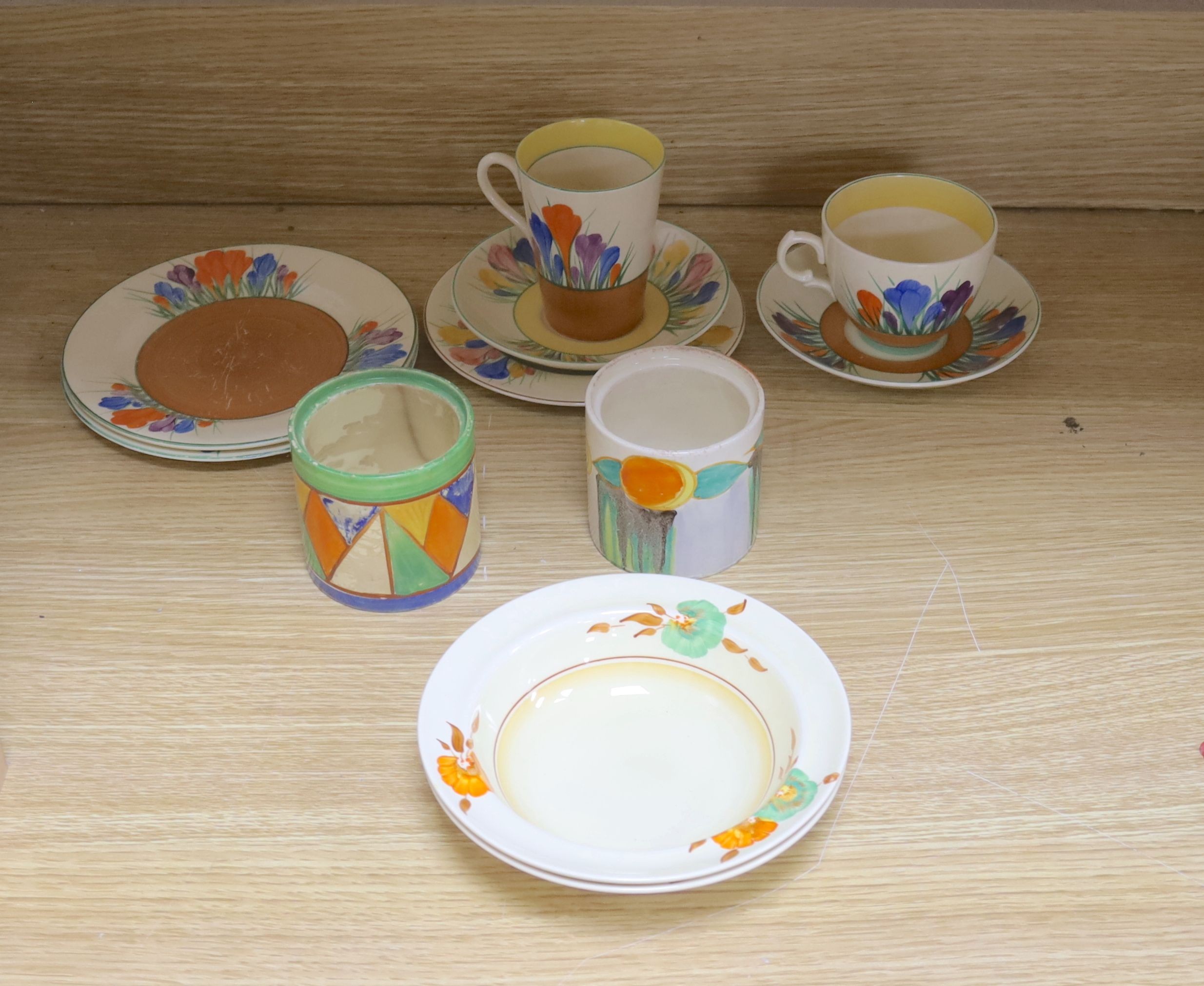 A quantity of Clarice Cliff pottery, Including Crocus pattern tea wares, two preserve jars missing Lids, a plate and three bowls